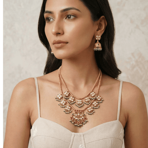 Luxurious uncut diamond Polki bridal set with pearl drops and meenakari work for a traditional wedding look.